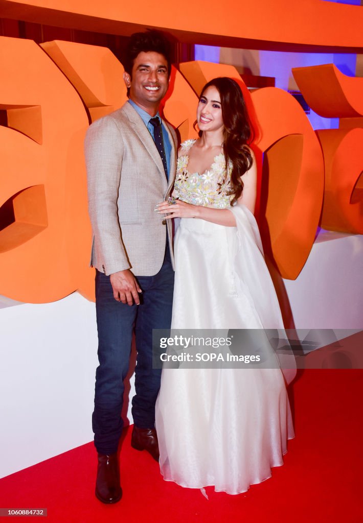 Actor Sushant Singh Rajput and Sara Ali Khan pose for photos...