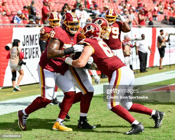 Washington Redskins tackle Morgan Moses and Washington Redskins center Luke Bowanko warm up prior to the first half of an NFL game between the...