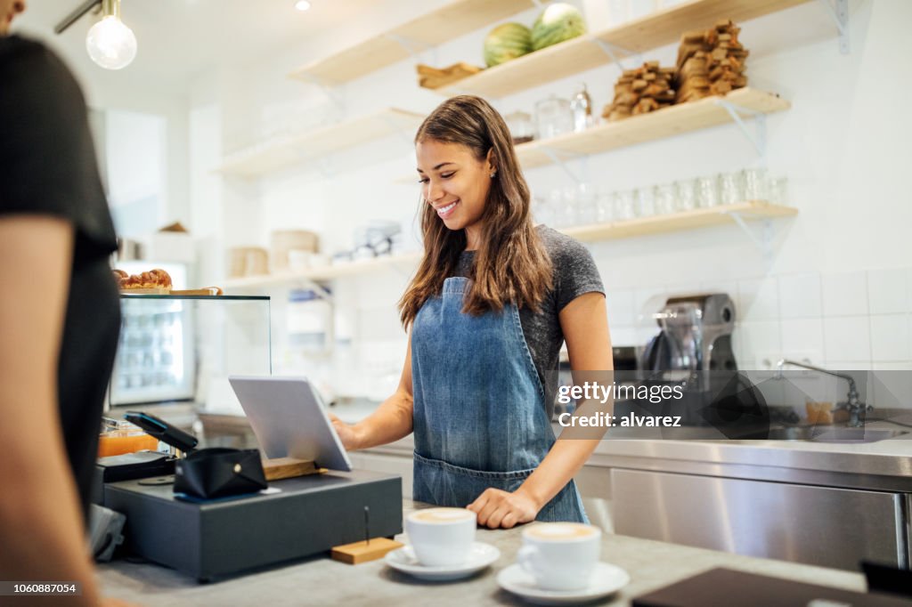 Barista taking order from customer cafe