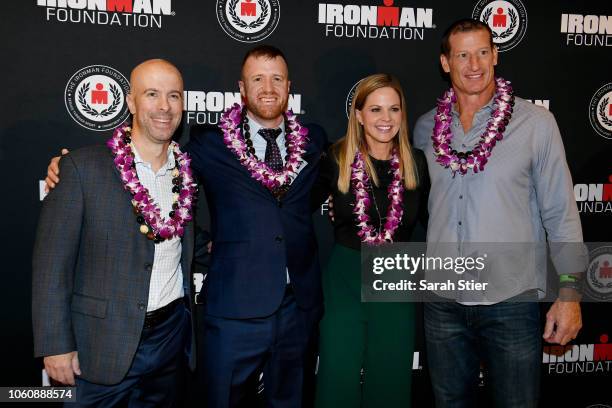 Derek Fitzgerald, Mike Ergo, Shannon Spake, and Don Davey pose for a photo on the red carpet during the IRONMAN World Championship Broadcast Premiere...