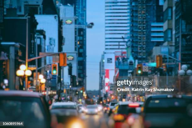 busy streets of blurry blue city - rush hour tilt shift stock pictures, royalty-free photos & images