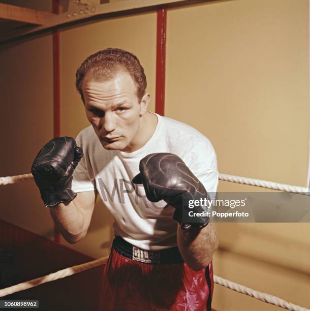 English heavyweight boxer Henry Cooper pictured during training in a boxing gym in England in December 1960. Current British and Commonwealth...