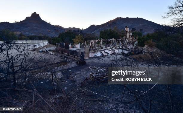 The remnants of a home destroyed in the Woolsey fire are seen November 12, 2018 along Mulholland Highway in the hills above Malibu, California....