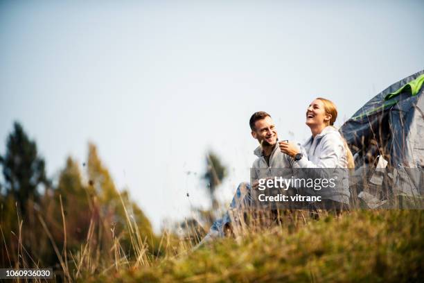 camping in the mountains - camping couple stock pictures, royalty-free photos & images
