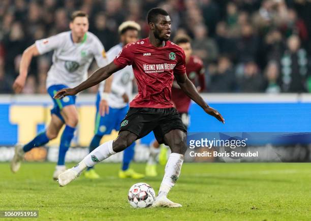 Ihlas Bebou of Hannover 96 scores his team's second goal by penalty during the Bundesliga match between Hannover 96 and VfL Wolfsburg at HDI-Arena on...