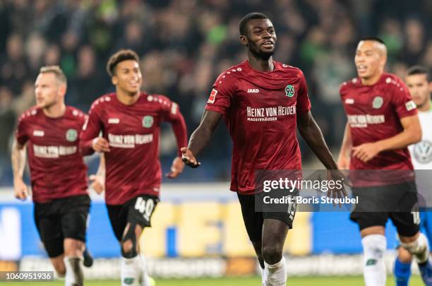 Ihlas Bebou of Hannover 96 celebrates with team mates after scoring his team's second goal during the Bundesliga match between Hannover 96 and VfL...