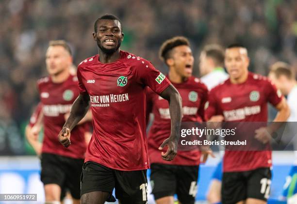 Ihlas Bebou of Hannover 96 celebrates with team mates after scoring his team's second goal during the Bundesliga match between Hannover 96 and VfL...