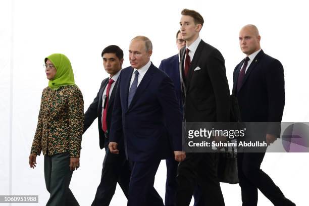 Singapore President Halimah Yacob and Russian President Vladimir Putin arrive at the groundbreaking ceremony of the Russian Cultural Centre on...