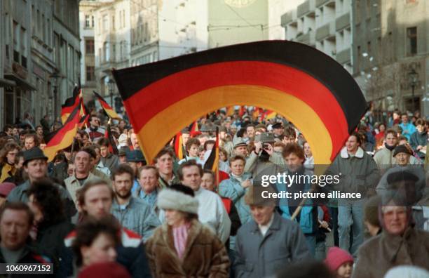 Numerous German flags captured during the demonstrations for the German-German reunification in Plauen, GDR, 27 January 1990. Prior to that, the SED...
