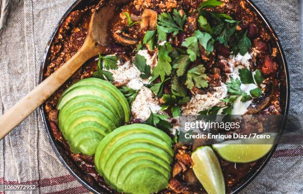 mexican mushroom, tofu chilli pot to share with avocado - meat substitute stock pictures, royalty-free photos & images
