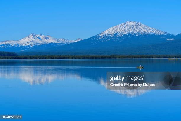 North America, USA, Central Oregon, Oregon, Deschutes County, Crane Prairie Reservoir with reflections of Mount Bachelor and Broken Top.