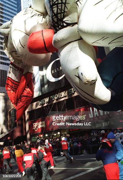 The Cat in the Hat balloon struggles to stay put in high winds during the Macy's Thanksgiving Day Parade in Manhattan on November 27, 1997. His hat...