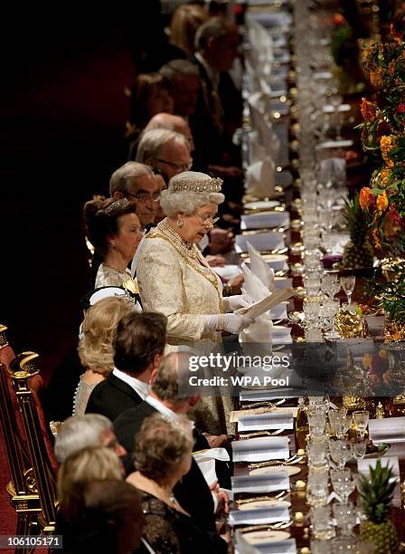 Queen Elizabeth II delivers a speech before a banquet held during the state visit of Qatar's Emir Sheikh Hamad bin Khalifa al-Thani and his wife...