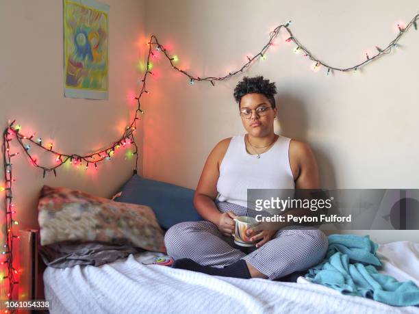 Woman on Her Bed Drinking Coffee
