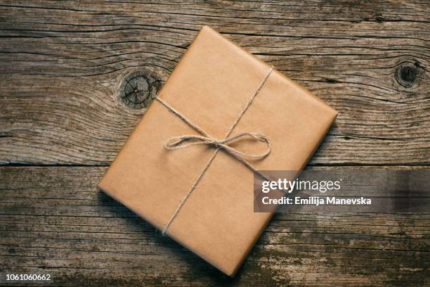 gift on wooden table - macedonia country stock pictures, royalty-free photos & images