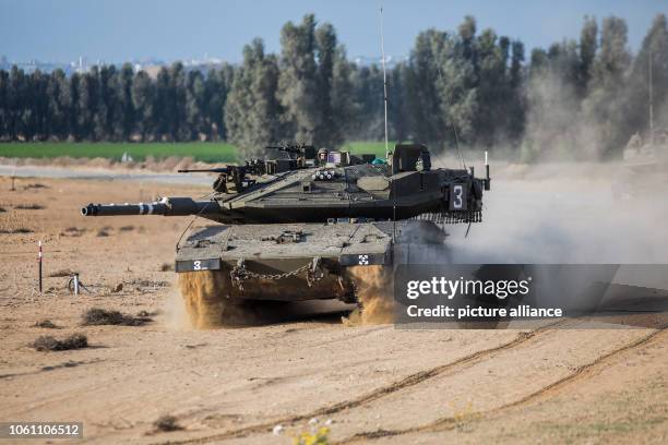 November 2018, Israel, ---: An Israeli soldier rides on a Merkava battle tank stationed along the Israeli-Gaza border. According to Israeli army...