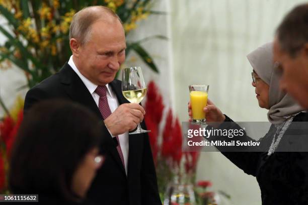 Russian President Vladimir Putin toasts with Singapore President Halimah Yacob on November 13, 2018 in Singapore, Singapore. Vladimir Putin has...