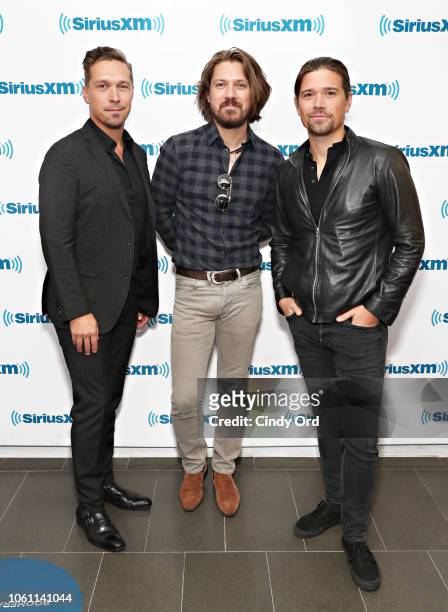 Isaac Hanson, Taylor Hanson and Zac Hanson of Hanson visit the SiriusXM Studios on November 13, 2018 in New York City.