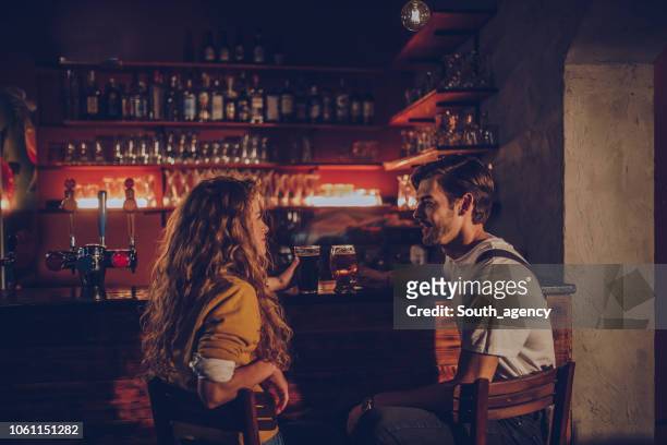 couple in pub - flirting imagens e fotografias de stock