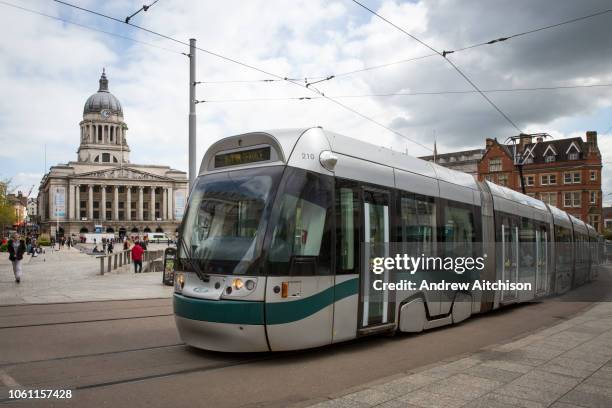Nottingham Express Transit tram, number 210, travelling through Nottingham city centre outside Old Market Square, Nottingham, Nottinghamshire, United...