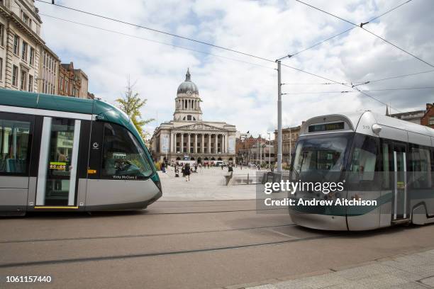 Nottingham Express Transit trams, travelling through Nottingham city centre outside Old Market Square, Nottingham, Nottinghamshire, United Kingdom....