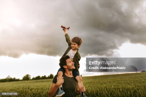 future airplane pilot - carrying on shoulders stock pictures, royalty-free photos & images