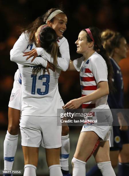 Mallory Pugh of United States congratulates team mate Alex Morgan after she scores the opening goal during the Women's International Friendly match...