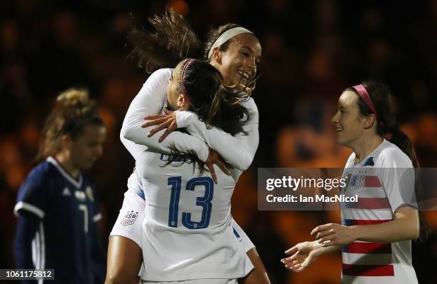 Mallory Pugh of United States congratulates team mate Alex Morgan after she scores the opening goal during the Women's International Friendly match...