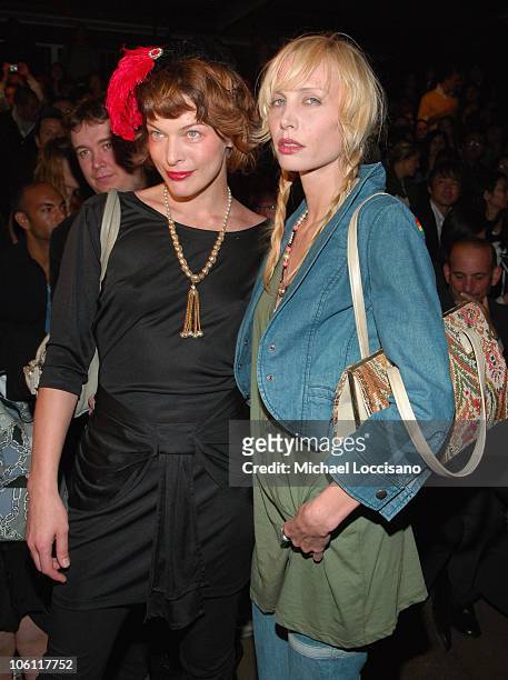 Milla Jovovich and Carmen Hawk during Olympus Fashion Week Spring 2007 - Y-3 - Front Row at Pier 40 in New York City, New York, United States.