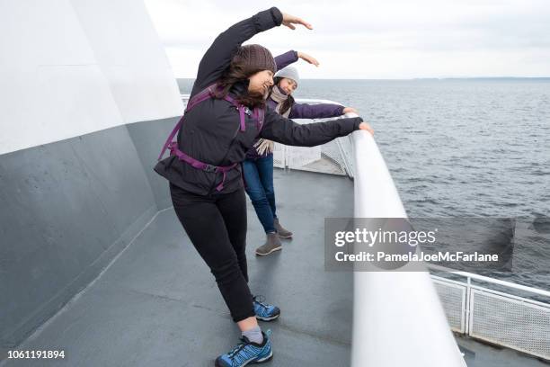 teen sisters practicing ballet on ferry deck, british columbia, canada - ferry passenger stock pictures, royalty-free photos & images