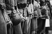 Close Up Of German Military Ammunition Of A German Soldier. World War II German Soldiers Standing Order. Photo In Black And White Colors. Soldiers Holding Weapon Rifle