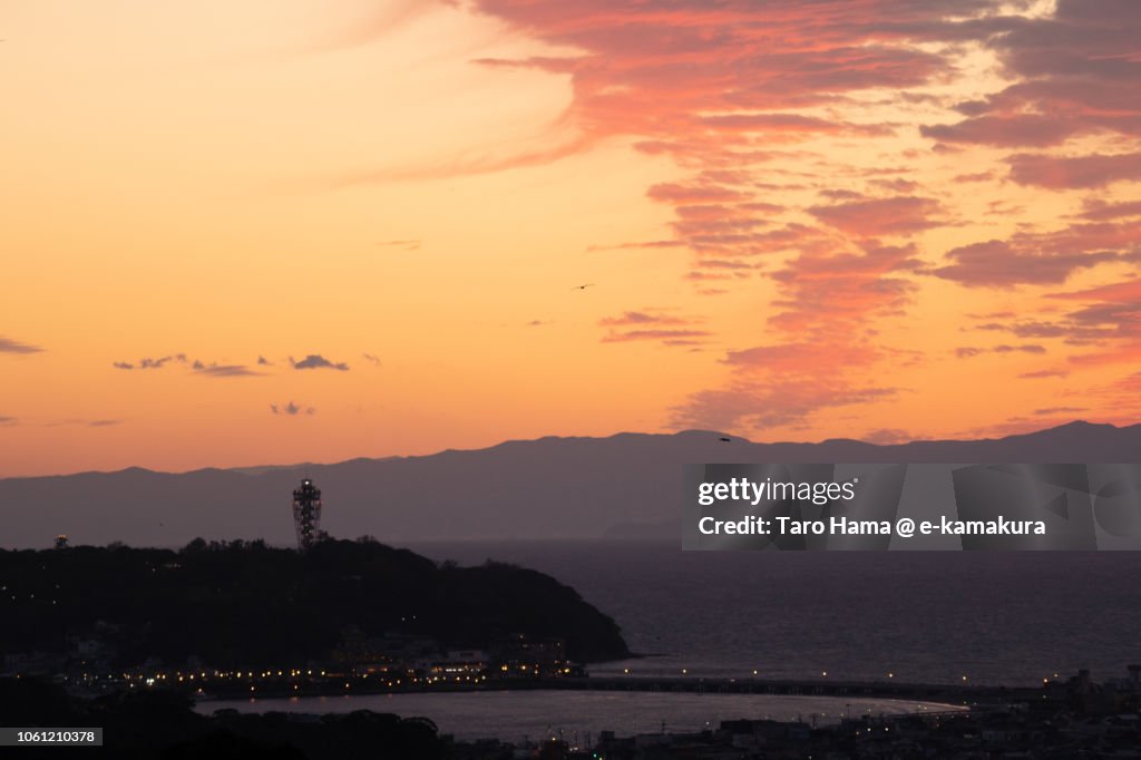 Red-colored sunset clouds on Sagami Bay, Enoshima Island and Izu Peninsula in Japan