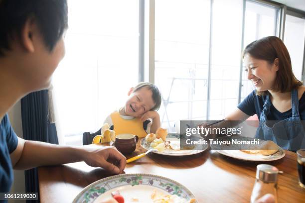 family who speaks with a smile while eating breakfast - baby　smile ストックフォトと画像