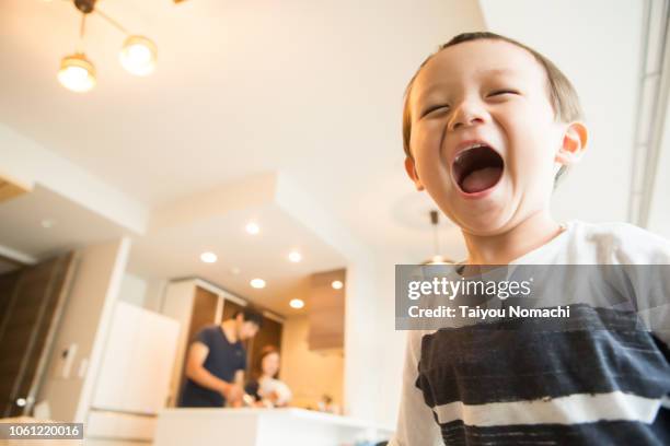 a boy who smiles loud - asian young boy smiling stock pictures, royalty-free photos & images