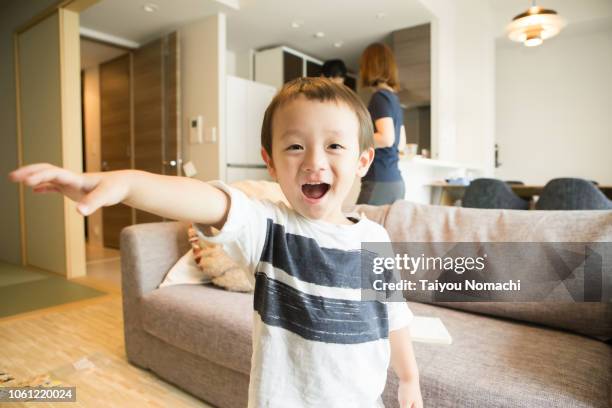 a boy posing towards the camera - living room front view stock pictures, royalty-free photos & images