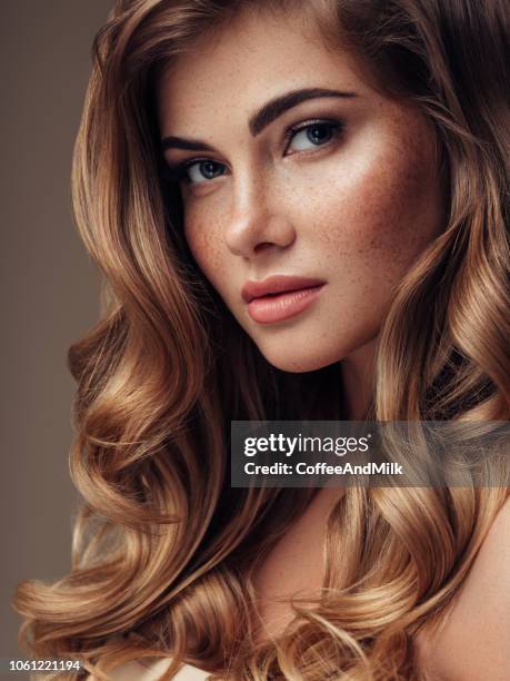 young beautiful model with long wavy well groomed hair - shiny wavy hair stock pictures, royalty-free photos & images