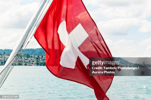 swiss flag on boat, zurich, switzerland - switzerland flag stock pictures, royalty-free photos & images