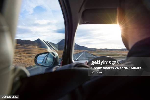 over the shoulder view of a man driving  the ring road in iceland. - car back view bildbanksfoton och bilder