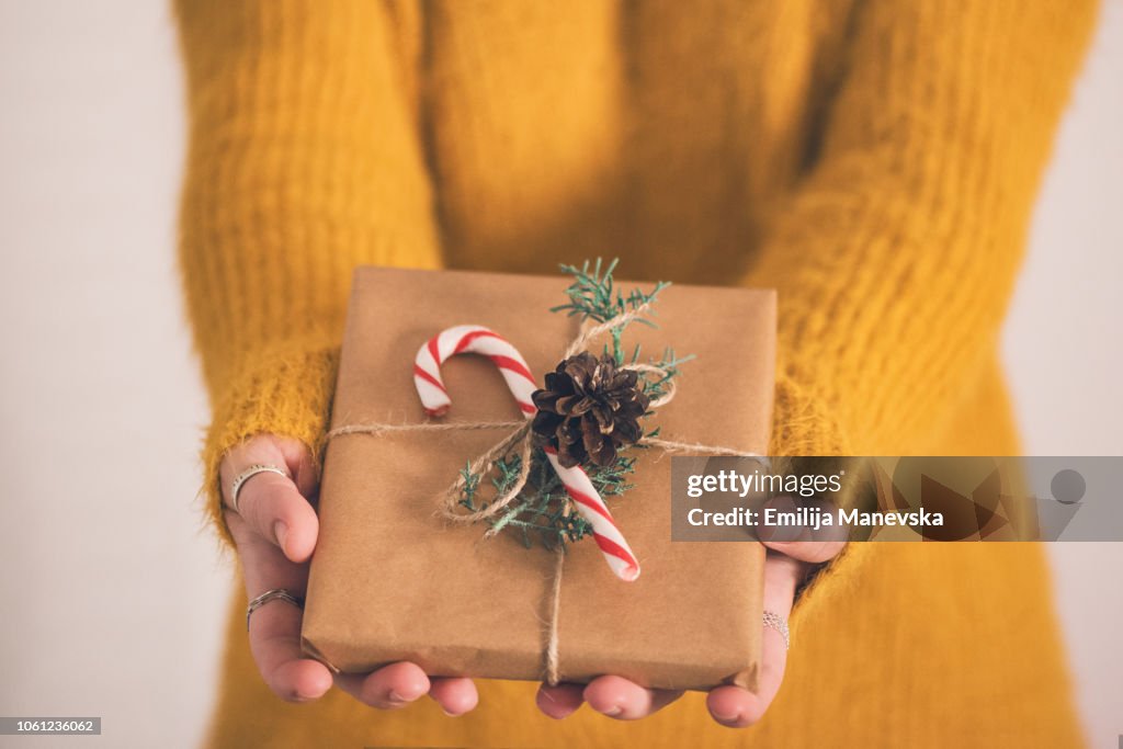 Close up of a woman holding gifts