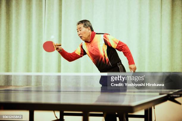 Senior man playing table tennis