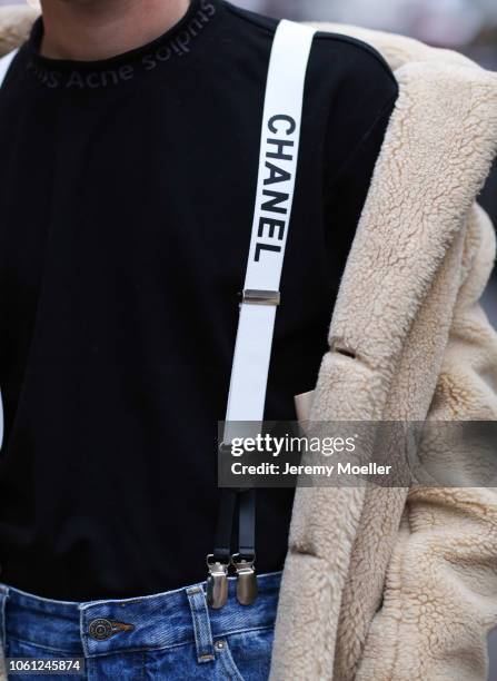 Erik Scholz wearing Chanel suspenders, Topman teddy coat, Acne Studios sneaker and a Acne Studios shirt on October 28, 2018 in Berlin, Germany.