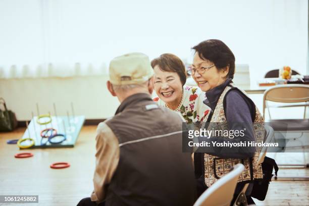 Senior people talking and play sports