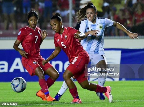 Argentina's Karla Riley vies for the ball with Panama's Vanessa Santana and Amancay Urbani during the Women's World Cup 2019 second leg qualifier...