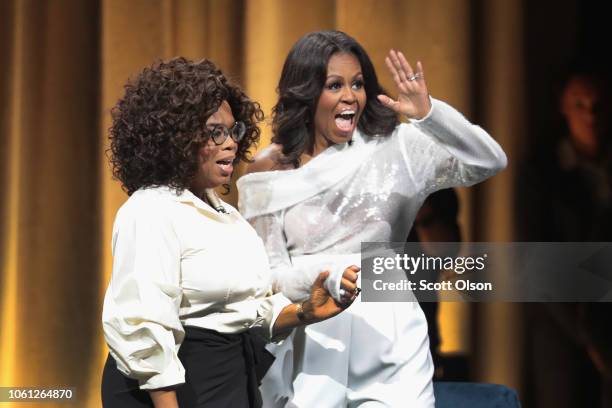 Oprah Winfrey introduces former first lady Michelle Obama as she kicks off her 'Becoming' arena book tour on November 13, 2018 in Chicago, Illinois....