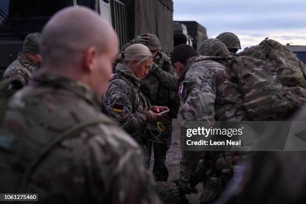 British soldiers prepare to take part in helicopter drills using a United States Army Chinook CH-47 helicopter during pre-exercise integration...