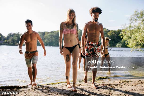 friends coming out of water after swim - 5 loch stock pictures, royalty-free photos & images