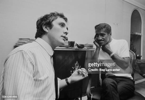 English actor Terence Stamp pictured with American singer and entertainer Sammy Davis Jr at a hotel in London on 10th April 1963.