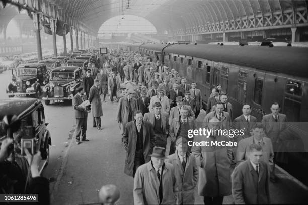 Farmers from the West Country arriving at Paddington Station in London to take part in a protest march on 10th April 1963. Farmers are protesting...