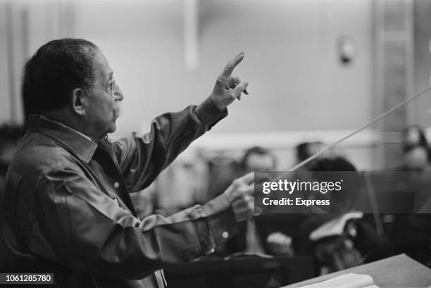French conductor Pierre Monteux pictured conducting an orchestra during a birthday concert on 8th April 1963.