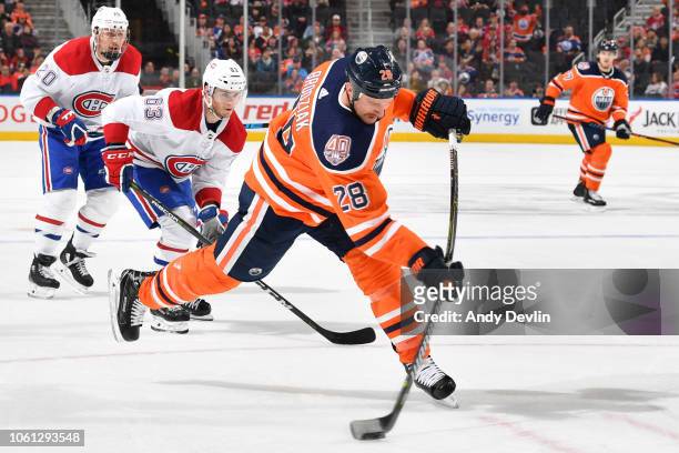 Kyle Brodziak of the Edmonton Oilers takes a shot during the game against the Montreal Canadiens on November 13, 2018 at Rogers Place in Edmonton,...